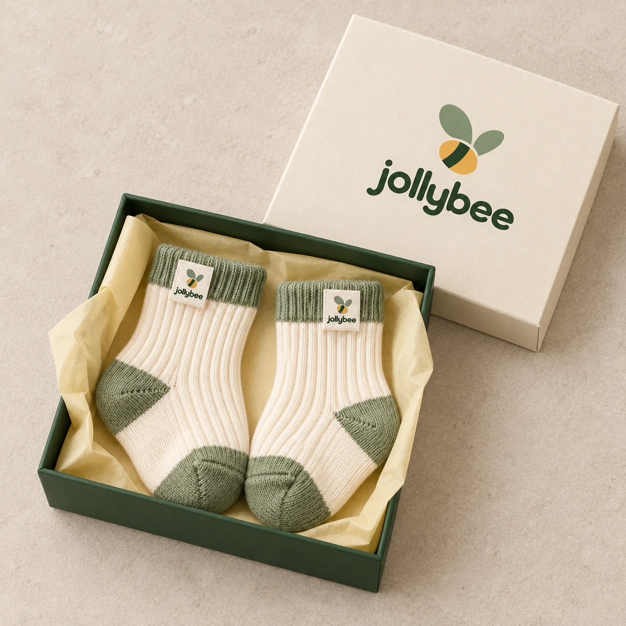 Jollybee two-tone baby socks placed inside its visible open branded box