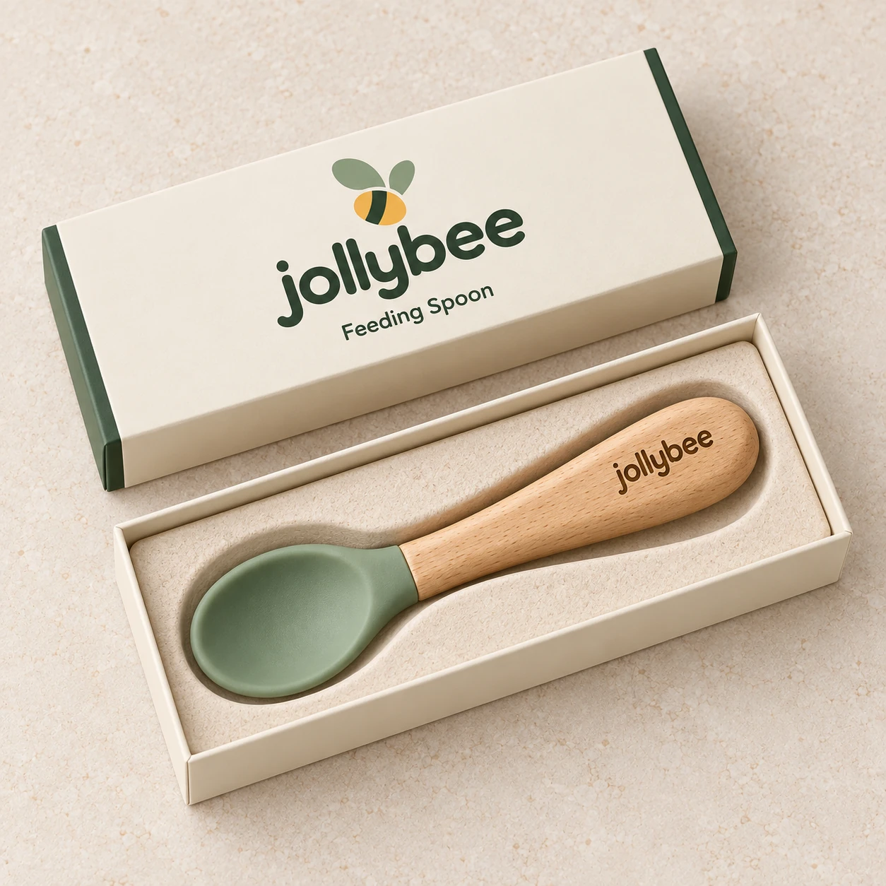 Jollybee silicone-tipped feeding spoon placed inside its visible open branded box